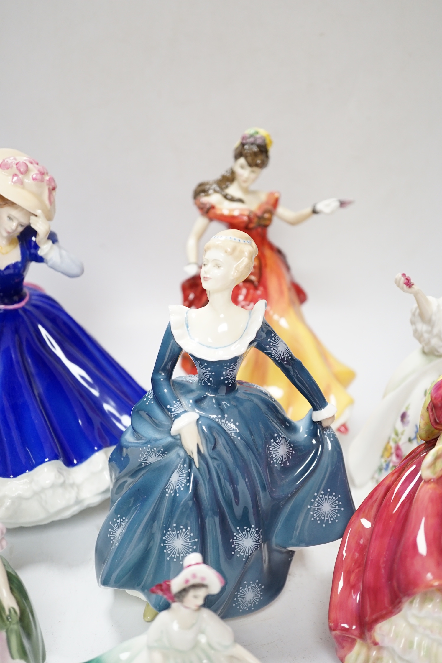 Seven Royal Doulton figurines, (two boxed), tallest 21cm